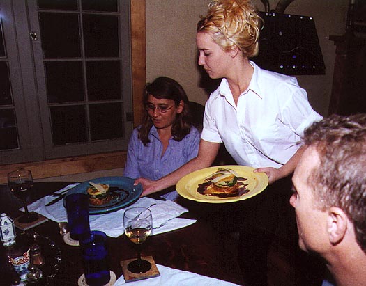 Emily Bullock serves the entree.