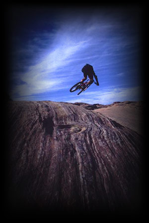 Guide jumping on the Moab Slick Rock Trail.